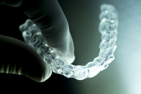 A Man holding Aligners