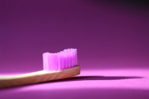 purple toothbrush on purple background