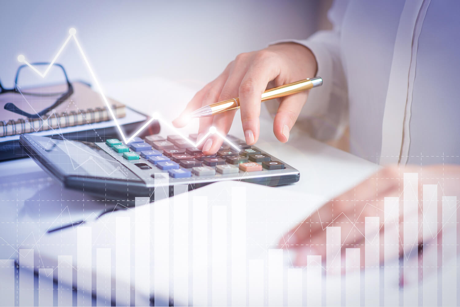 A person using a calculator with a pen in hand, surrounded by charts and graphs overlayed on the image, representing the meticulous financial planning essential for managing dental services effectively.